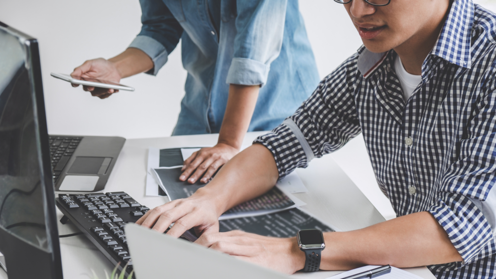 man at computer using shortcode